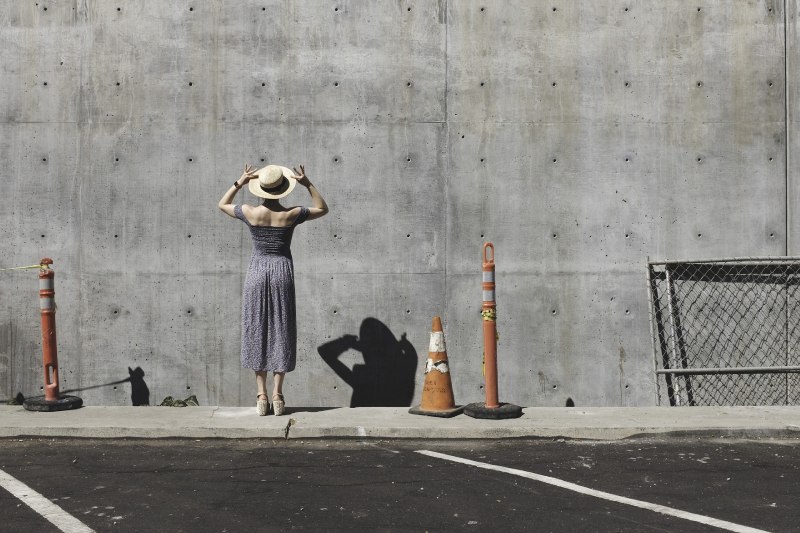 women surprise concrete wall